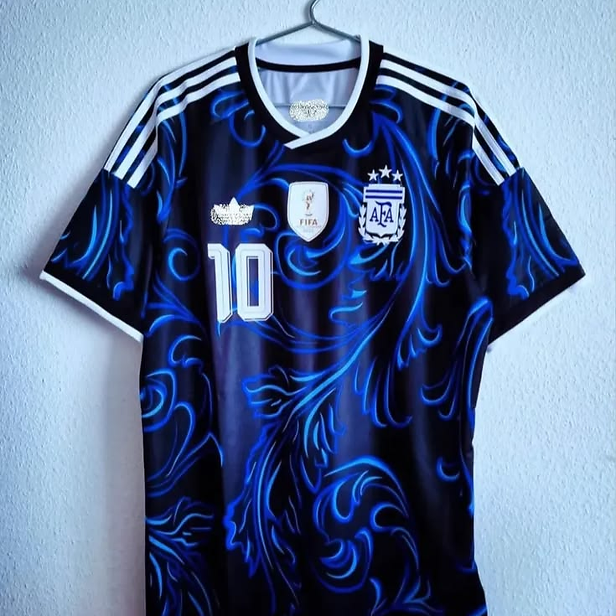 Argentina black away jersey displayed on a hanger
