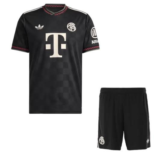 Black football jersey and shorts set on a clean white background