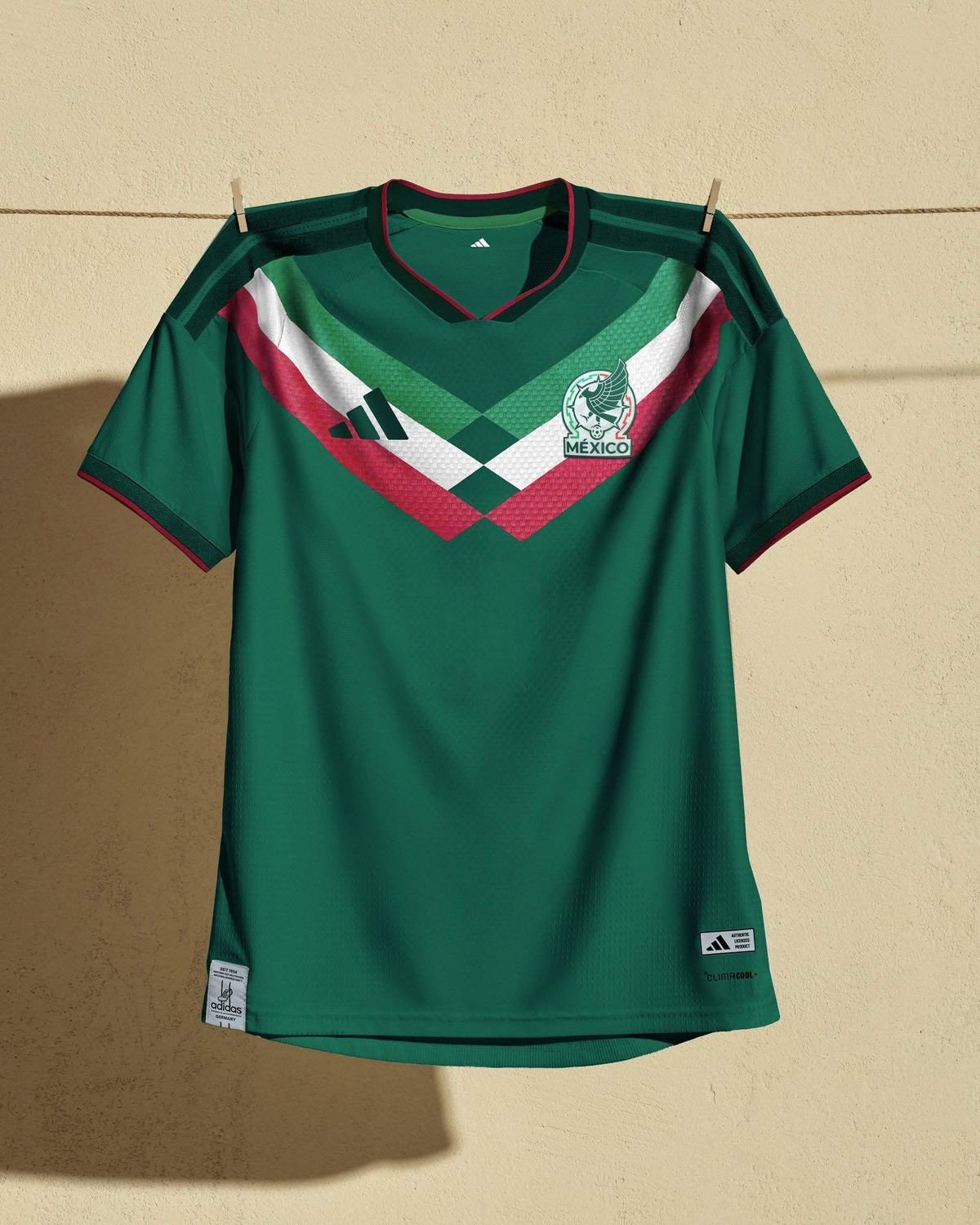 Green Mexico soccer jersey displayed on a clothesline