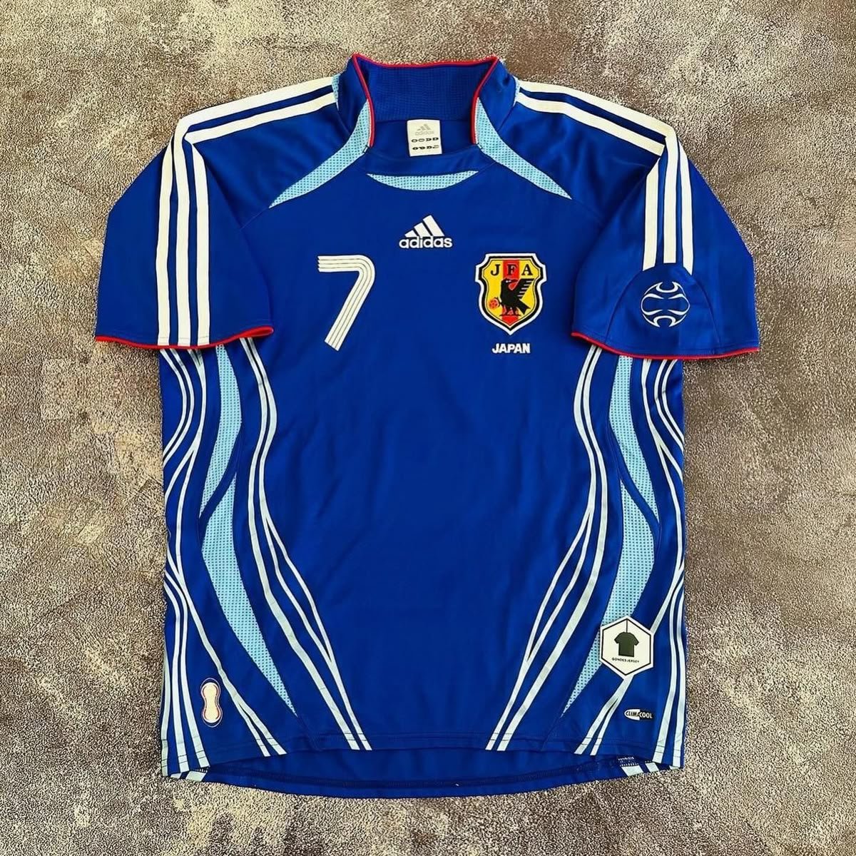 Blue Japan national team soccer jersey with light blue graphic details