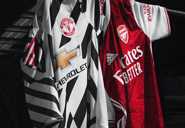 Two football jerseys displayed for replica and authentic comparison