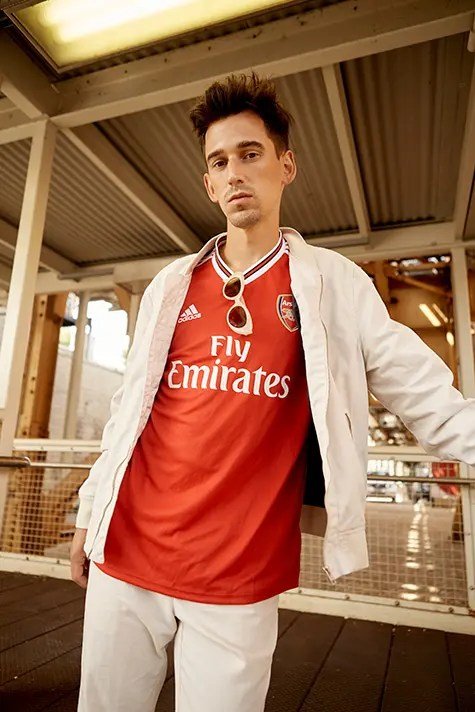 Football jersey layered with a light jacket