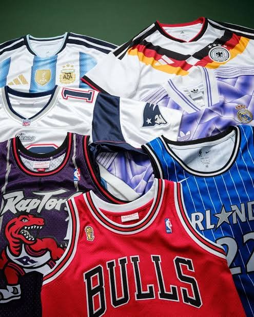 Football basketball and baseball jerseys showing sports gift variety