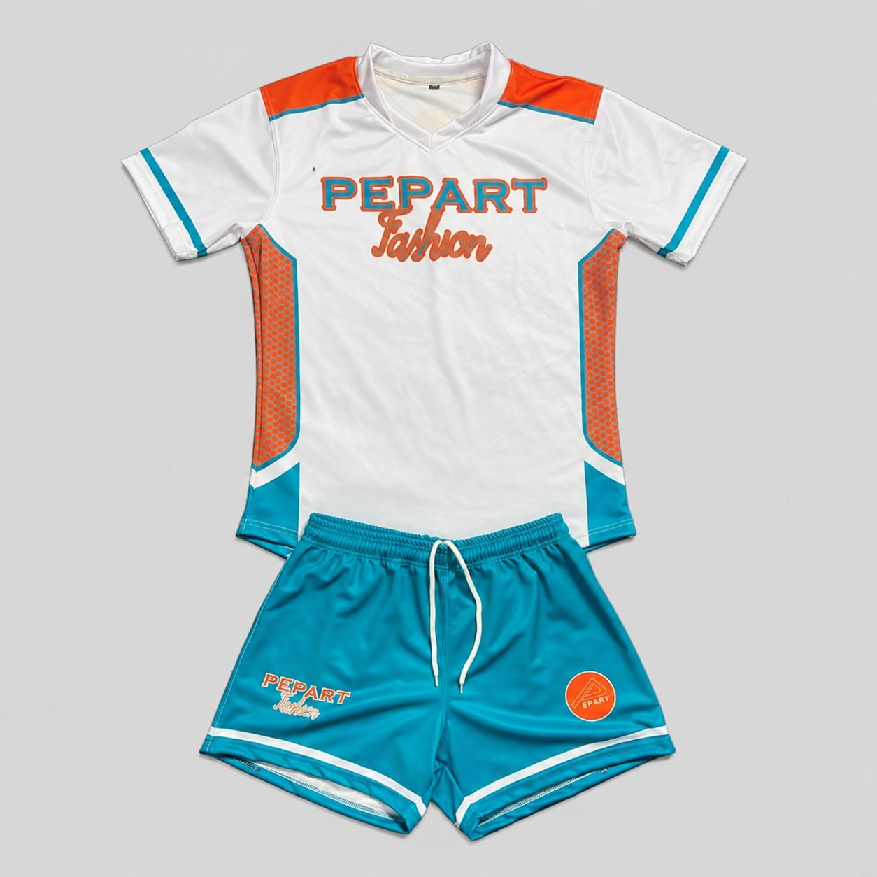 PEPART Fashion orange and teal youth soccer kit with mesh panels and matching drawstring shorts